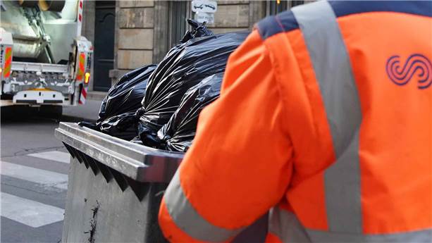 SUEZ employee collecting waste