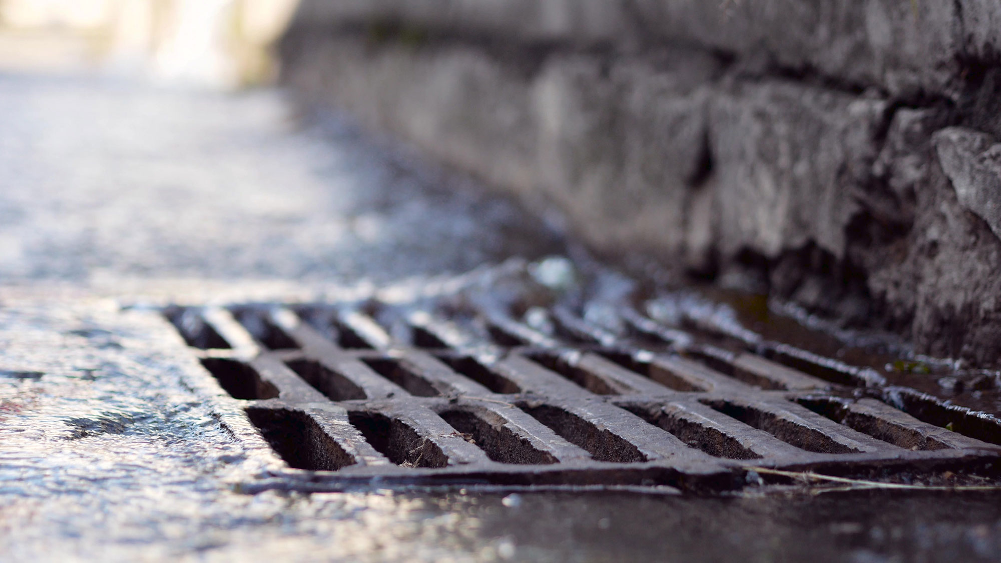 Rain water falling into sewerage drainage system